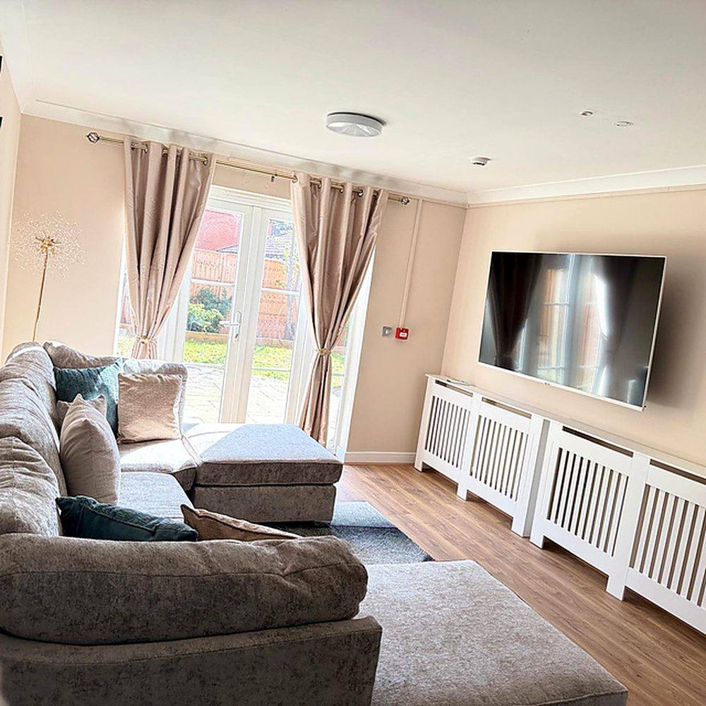 A relaxed corner of the living room at Hammond House with comfortable seating.